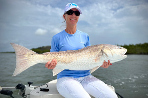 lady angler bull red drum fishing